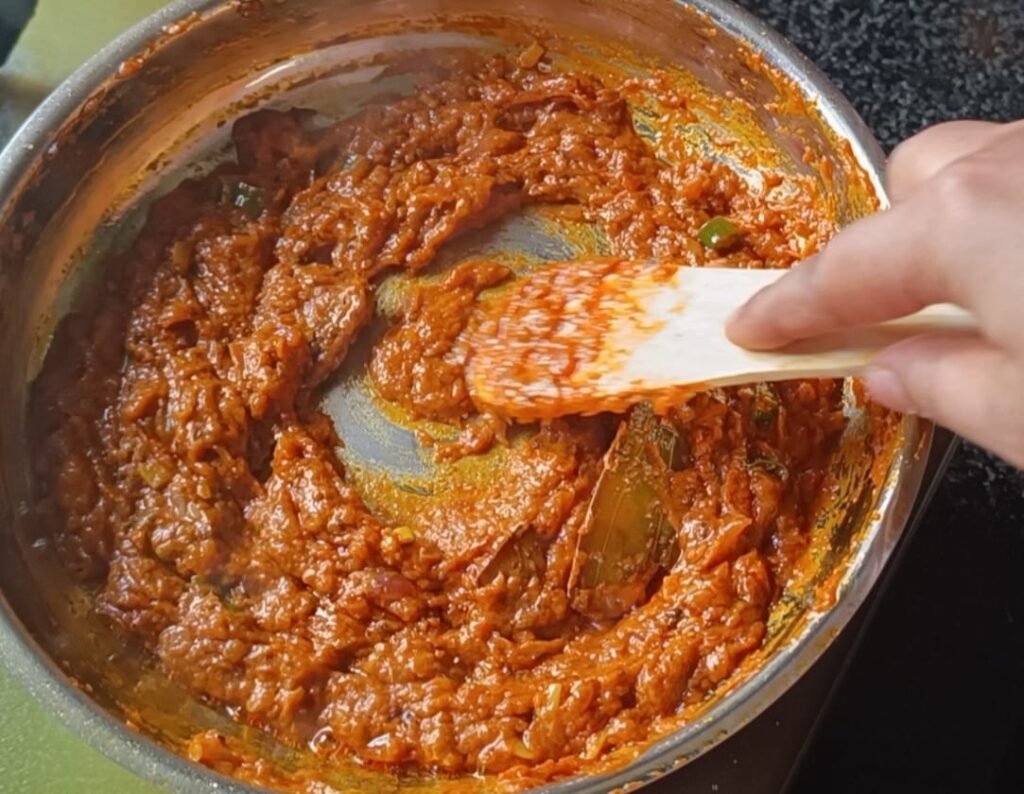 Gravy masala fry in a pan for paneer butter masala recipe