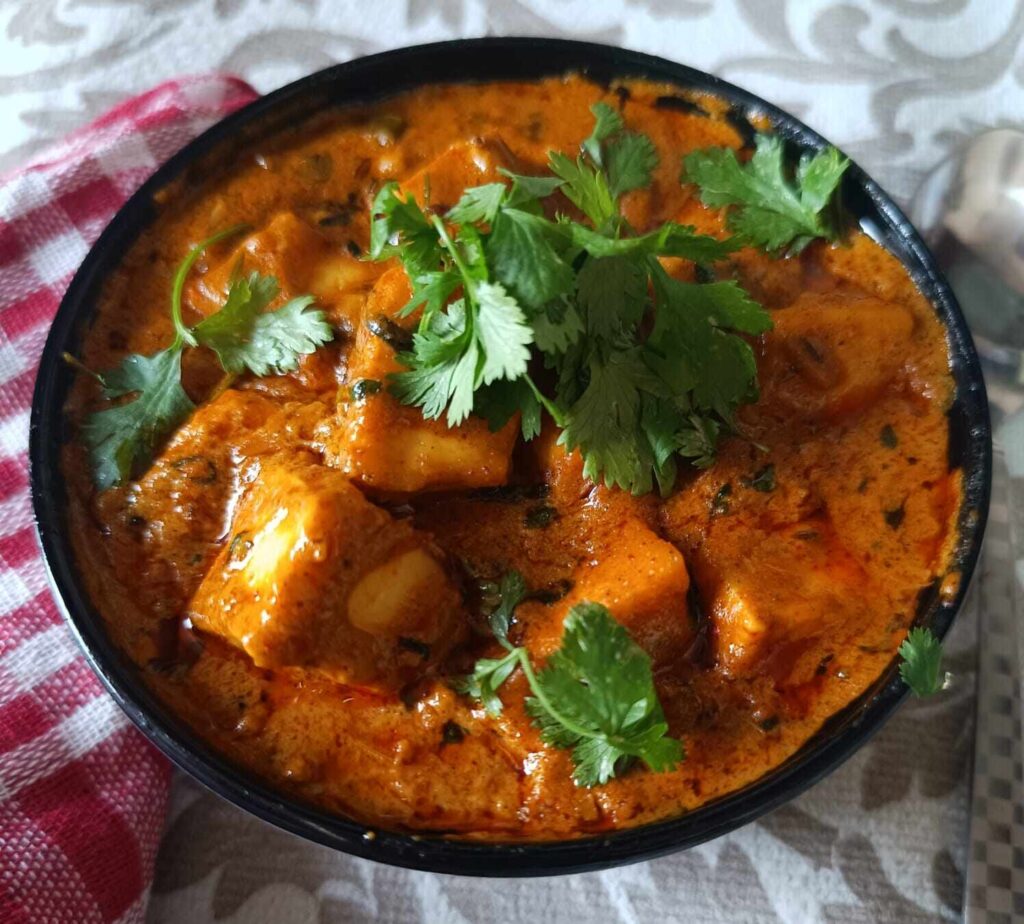 Paneer butter masala is ready to serve. Is is showing in a bowl