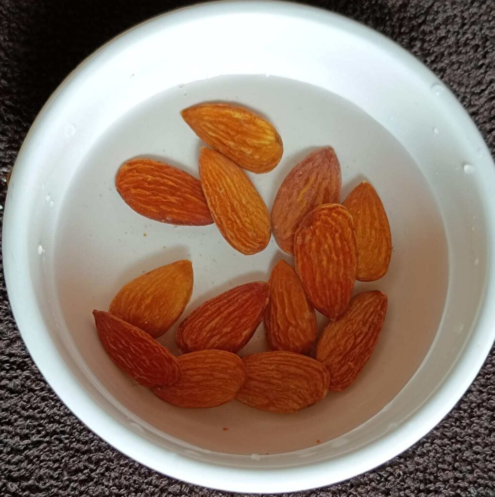 10-12 pieces of almonds are soaked in water for overnight for mango chia seed pudding