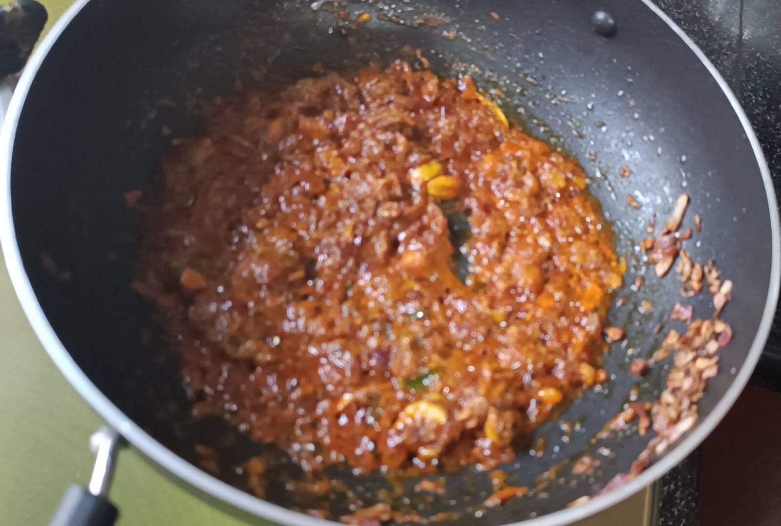 Sauteing all the spices like turmeric powder, kashmiri chilli powder, spicy chilli powder, coriander powder for matar mushroom ki sabji