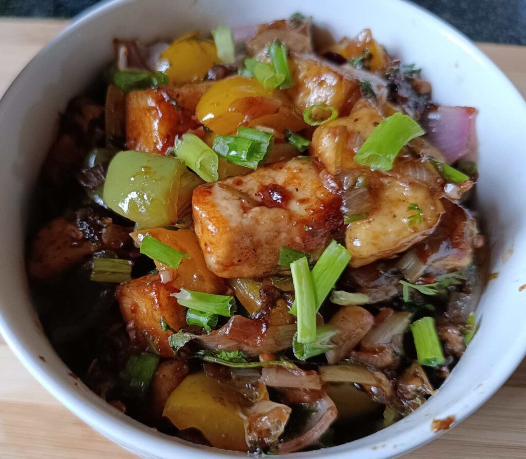 veg chilli paneer recipe kept in a bowl to serve.