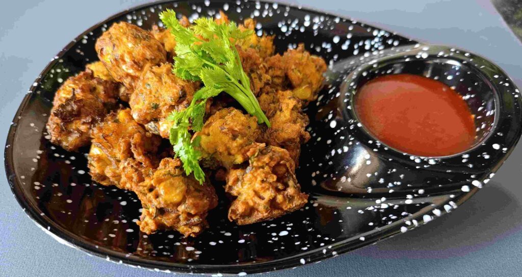 Sweet corn pakoda recipe is ready to serve on a plate