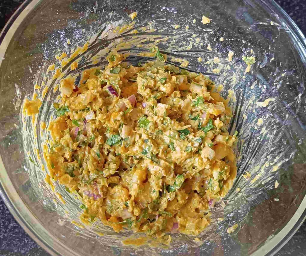 All the ingredients are mixed in a bowl for the sweet corn recipe